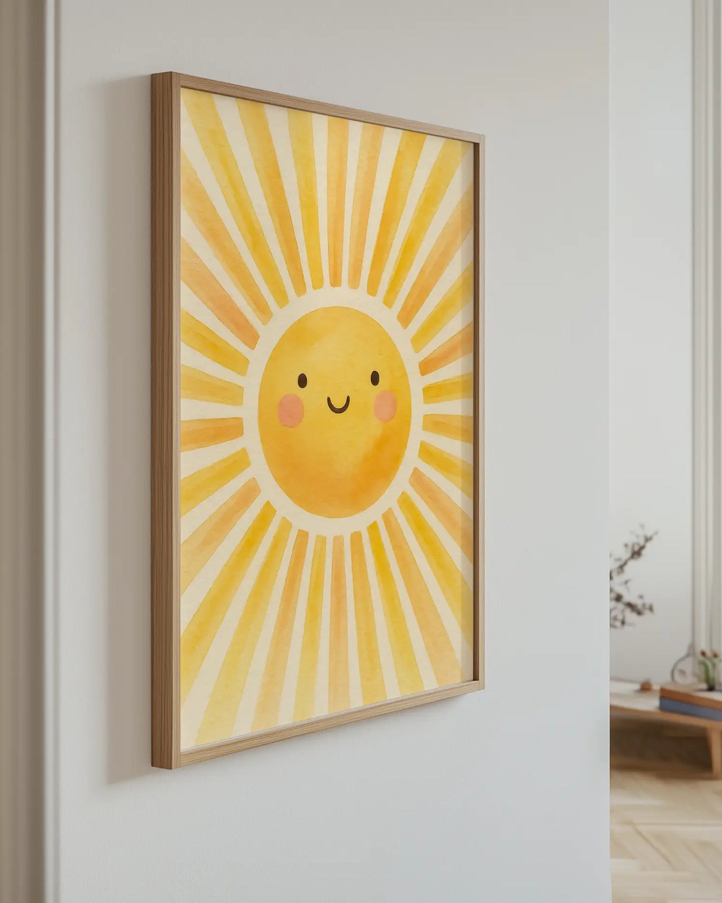 Children's artwork of a smiling sun on a white wall