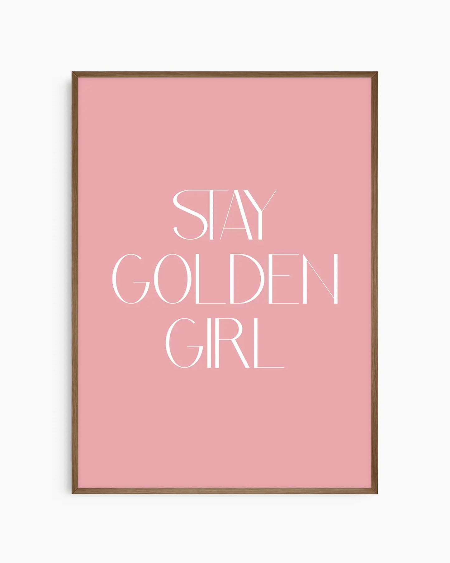 Nursery poster with 'Stay Golden Girl' text on a pink background framed in a dark oak frame