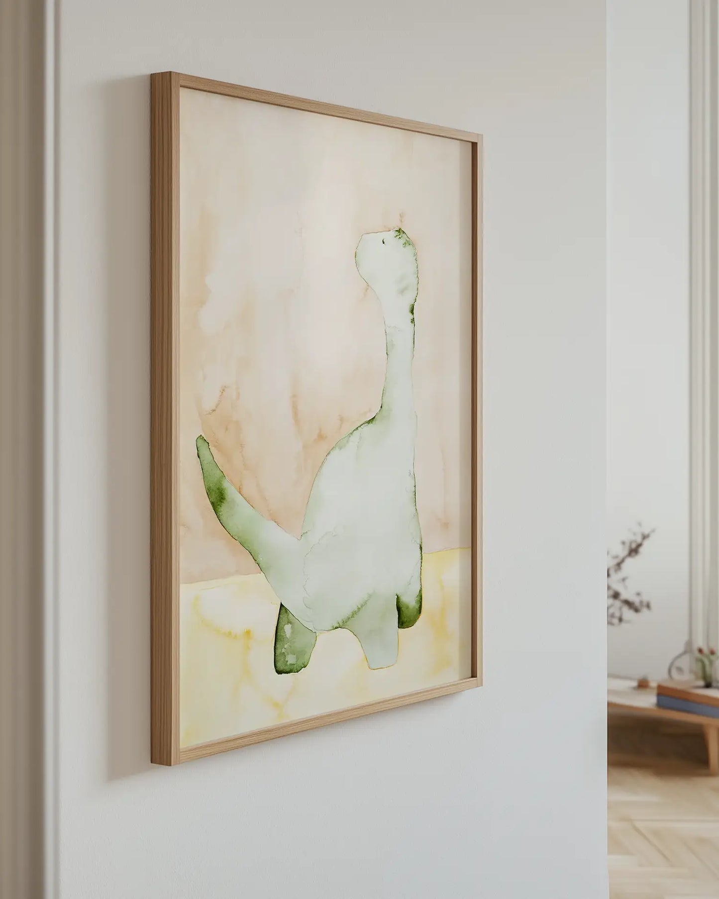 Children's artwork of a dinosaur on a wall in a room with a wooden floor.