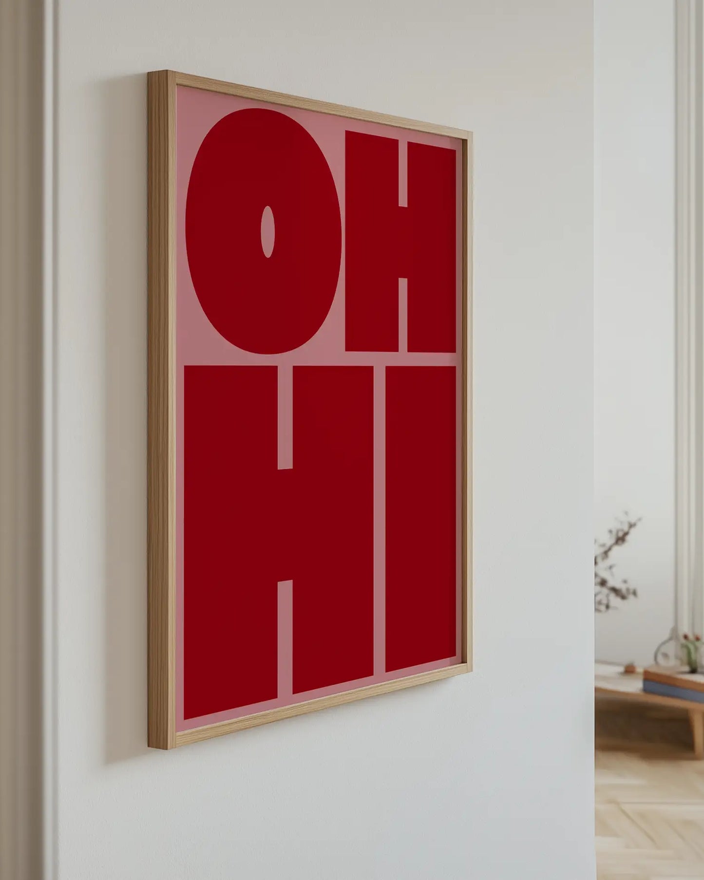 Red and pink poster with the text "OH HO" on the wall