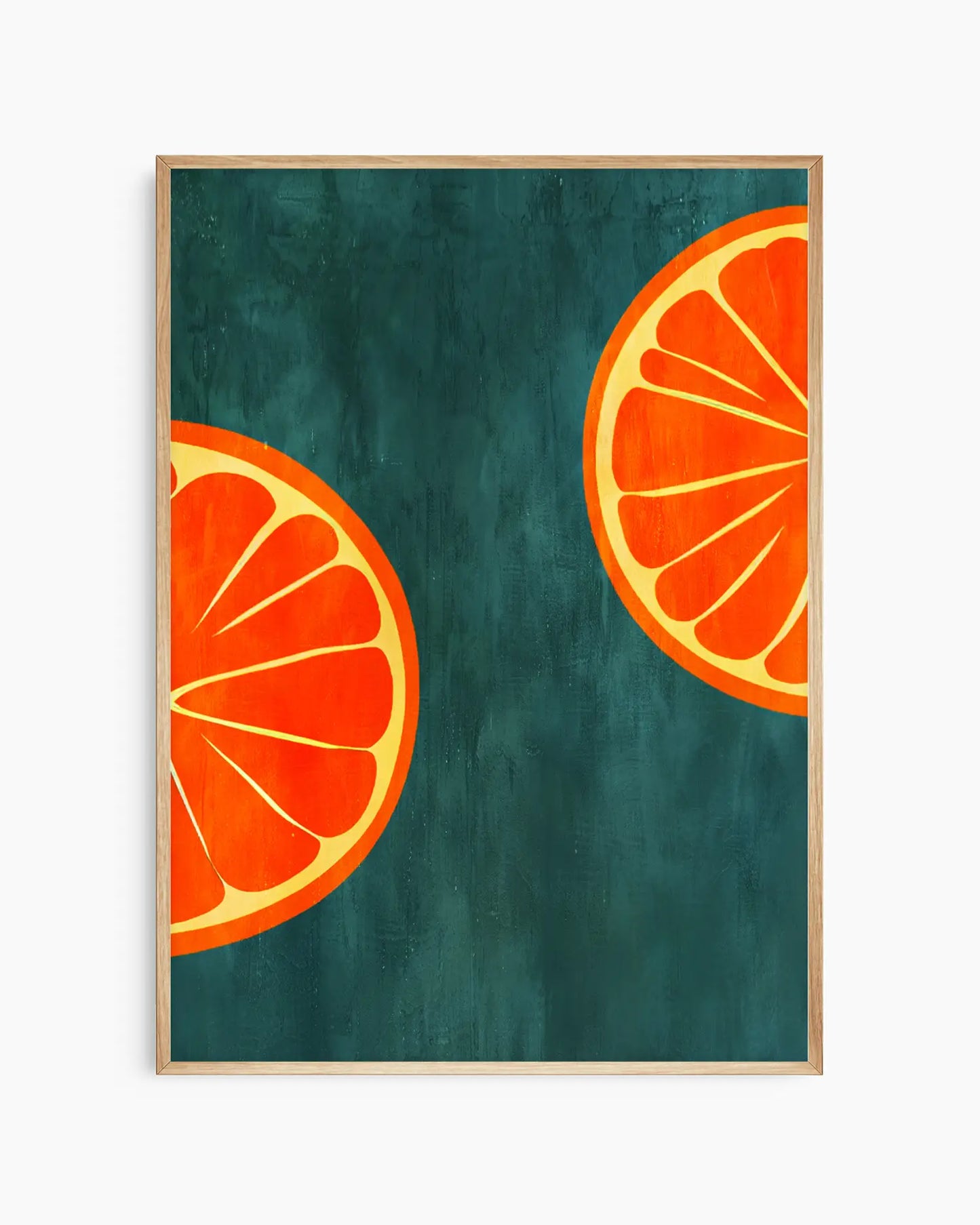 Framed artwork of two orange slices on a teal background