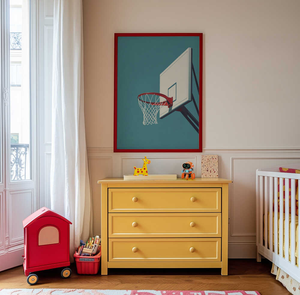 Children's poster of a basketball hoop hanging on the wall above a yellow chest of drawers