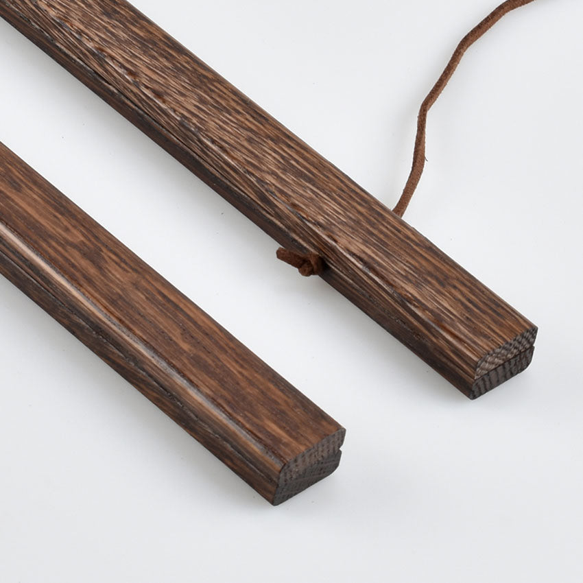 Dark oak poster hanger closeup