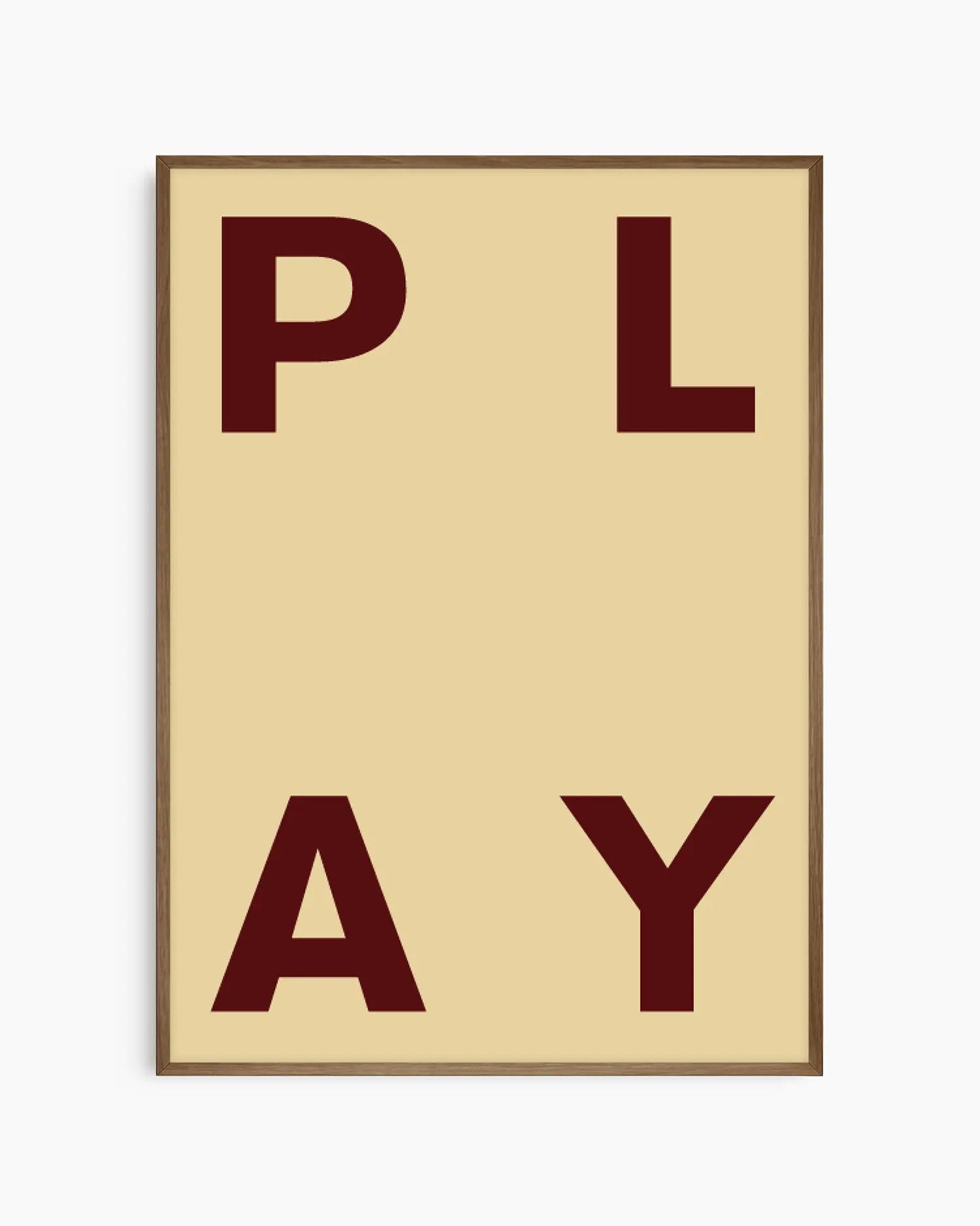 Beige nursery poster with maroon letters spelling 'PLAY' on a beige background framed in a dark oak frame.