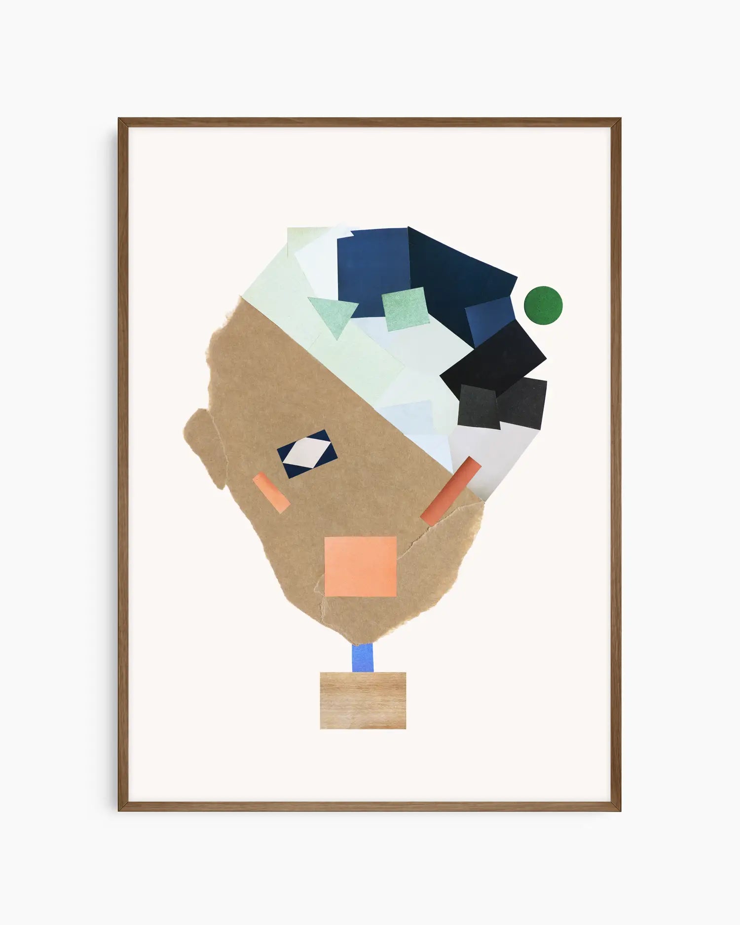 Nursery poster of a collage face made from colorful shapes on a white background framed in a dark oak frame.