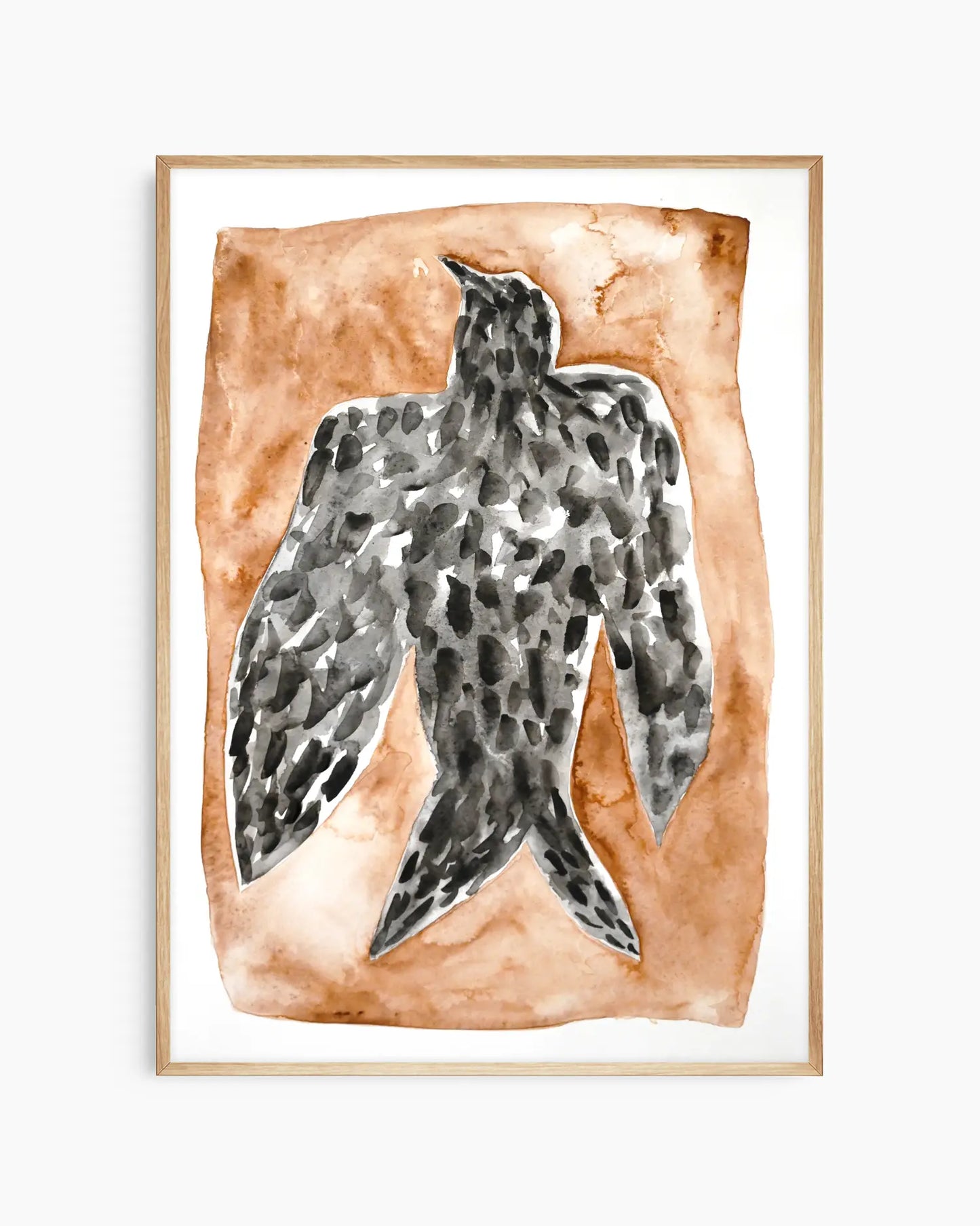 Artwork for the nursery of a black falcon on a brown background framed in an oak frame.
