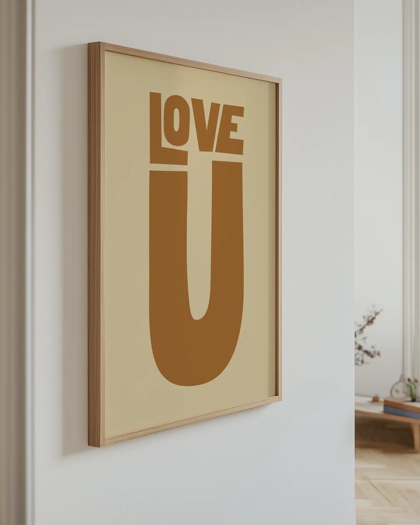 Framed artwork with 'LOVE U' text on a beige background