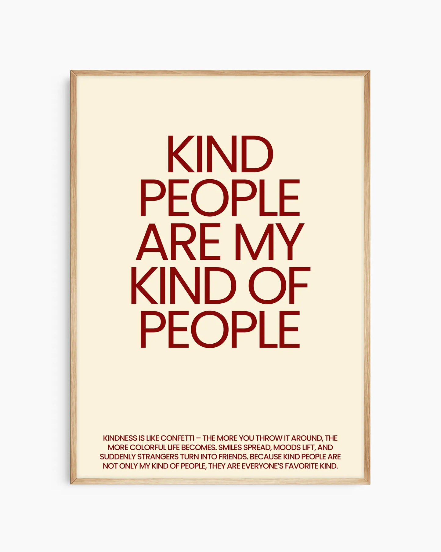 Nursery poster saying 'Kind people are my kind of people' in red, framed in an oak frame.