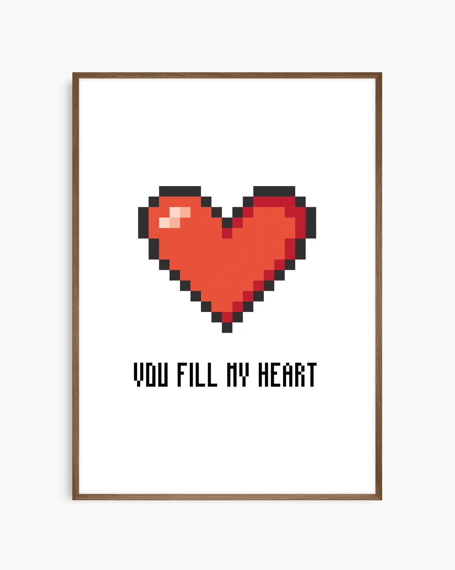Nursery poster with a red pixel heart and the text 'You Fill My Heart' text on a white background, framed in a dark oak wooden frame.