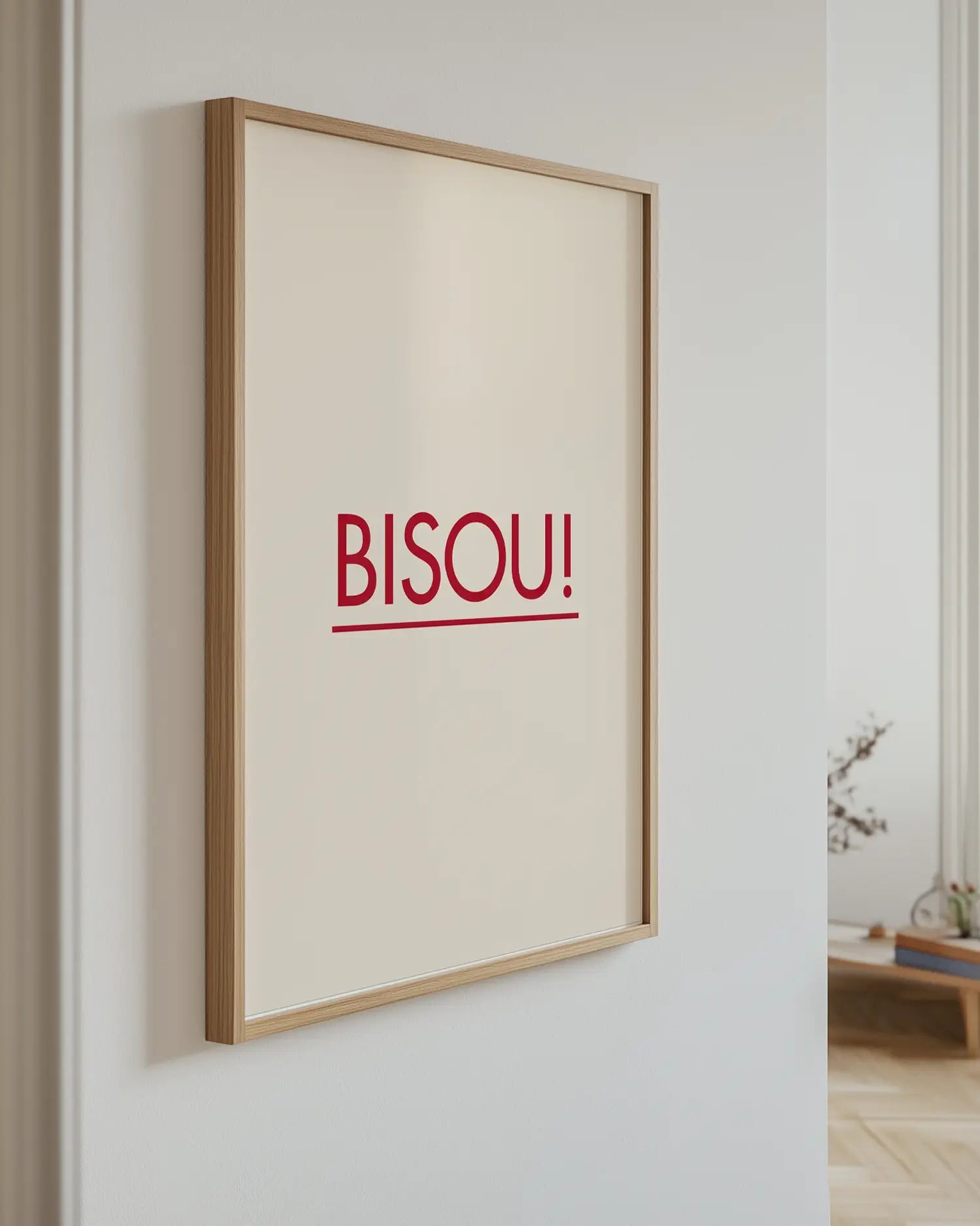 Poster with the text "BISOU!" on the wall