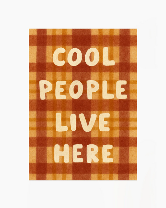 Typographic poster with the message “COOL PEOPLE LIVE HERE” in soft beige on a warm checking pattern, perfect for a cosy and personality-filled space.