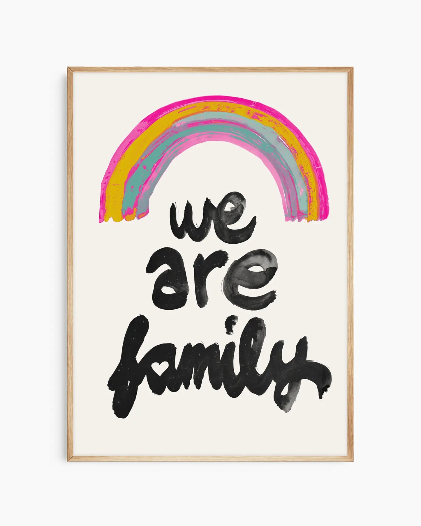 Framed artwork with a rainbow and 'we are family' text on a white background