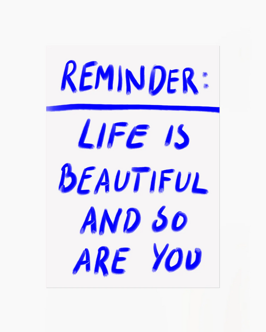 Motivational quote 'Reminder: Life is beautiful and so are you' in blue text on a white background