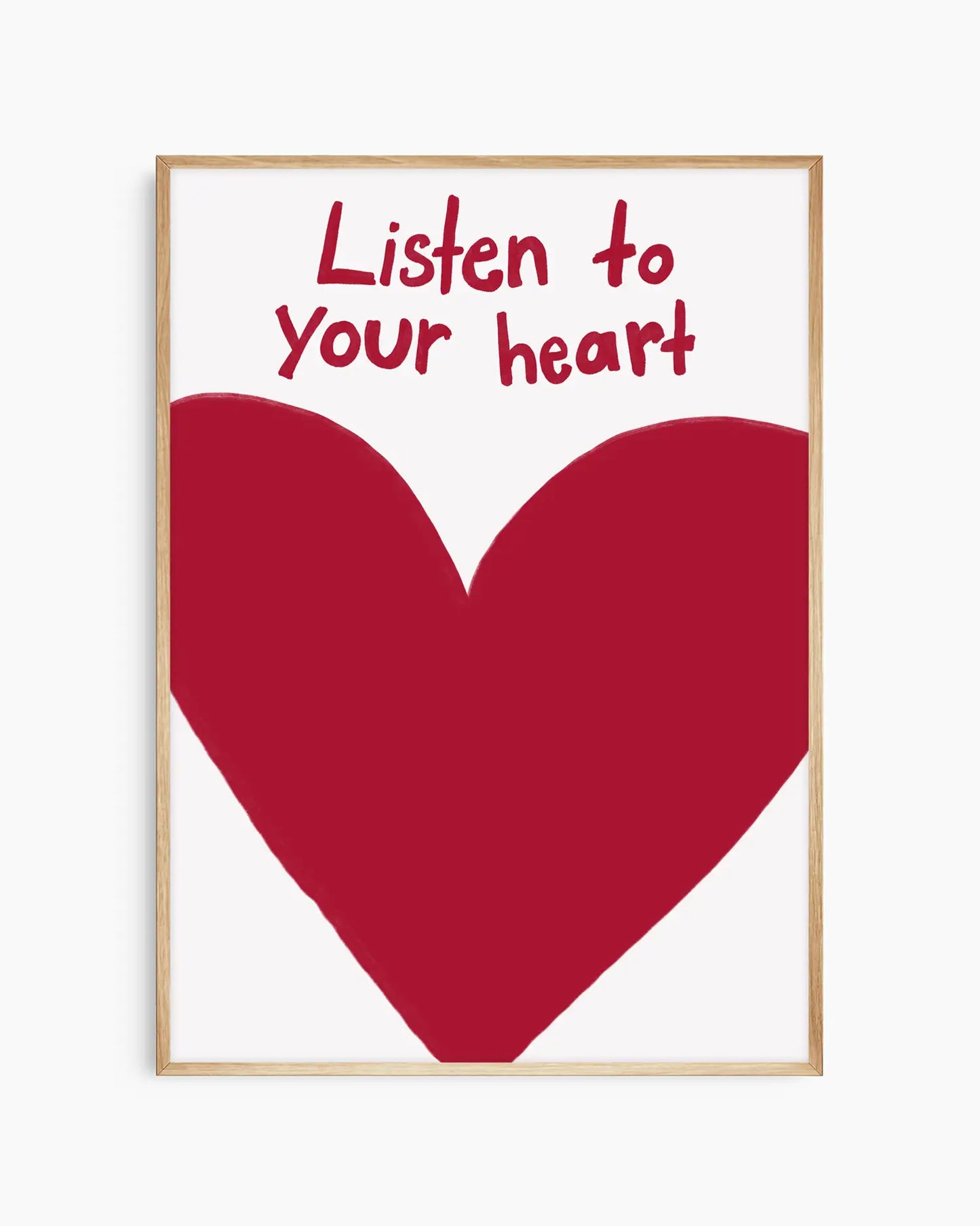 Framed poster with a red heart and 'Listen to your heart' text on a white background