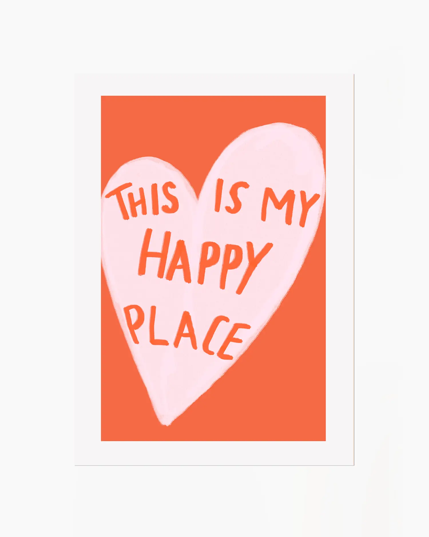 Heart-shaped sign with 'This is my happy place' text on an orange background