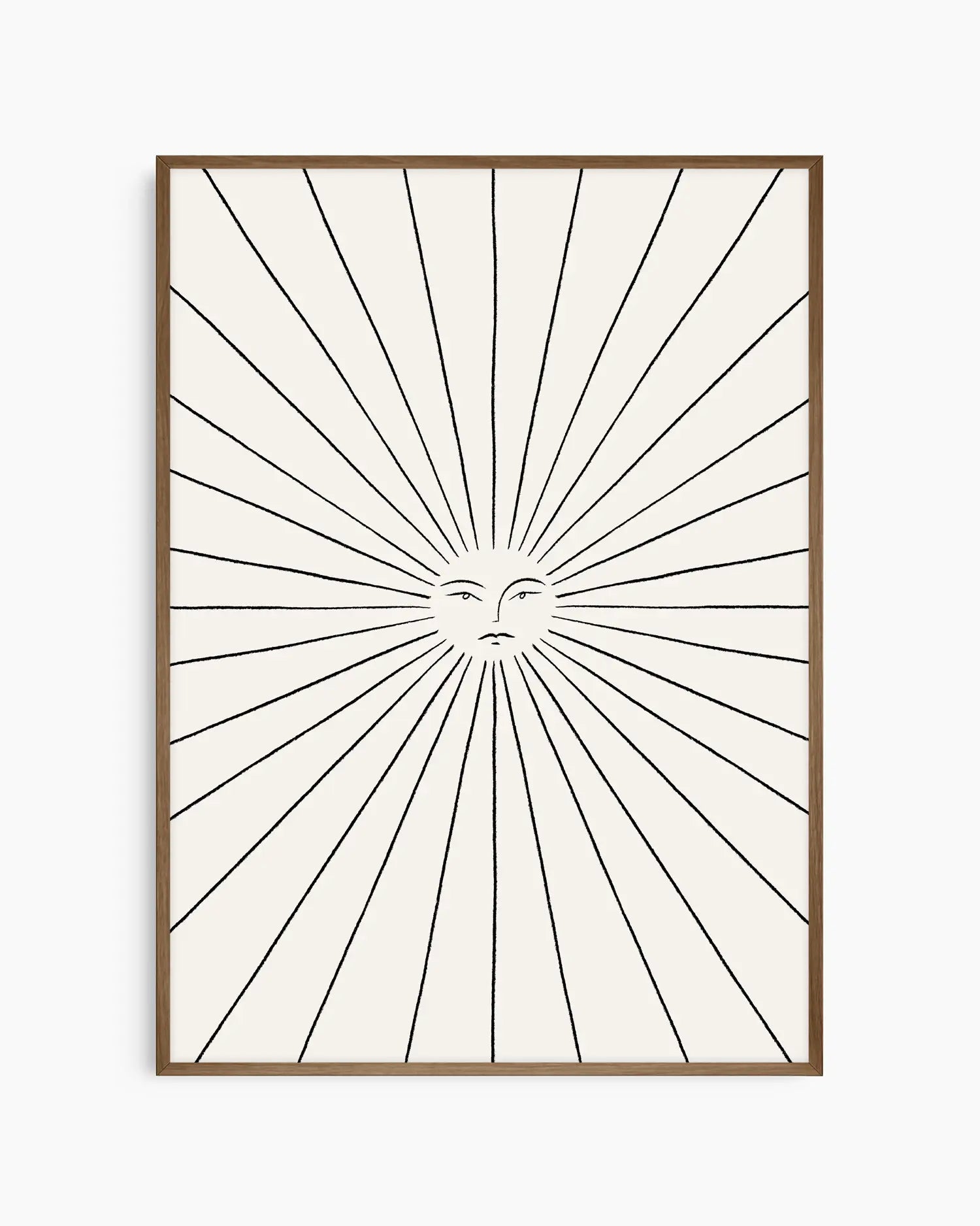 Framed artwork with sunburst design and face in the center on a white background