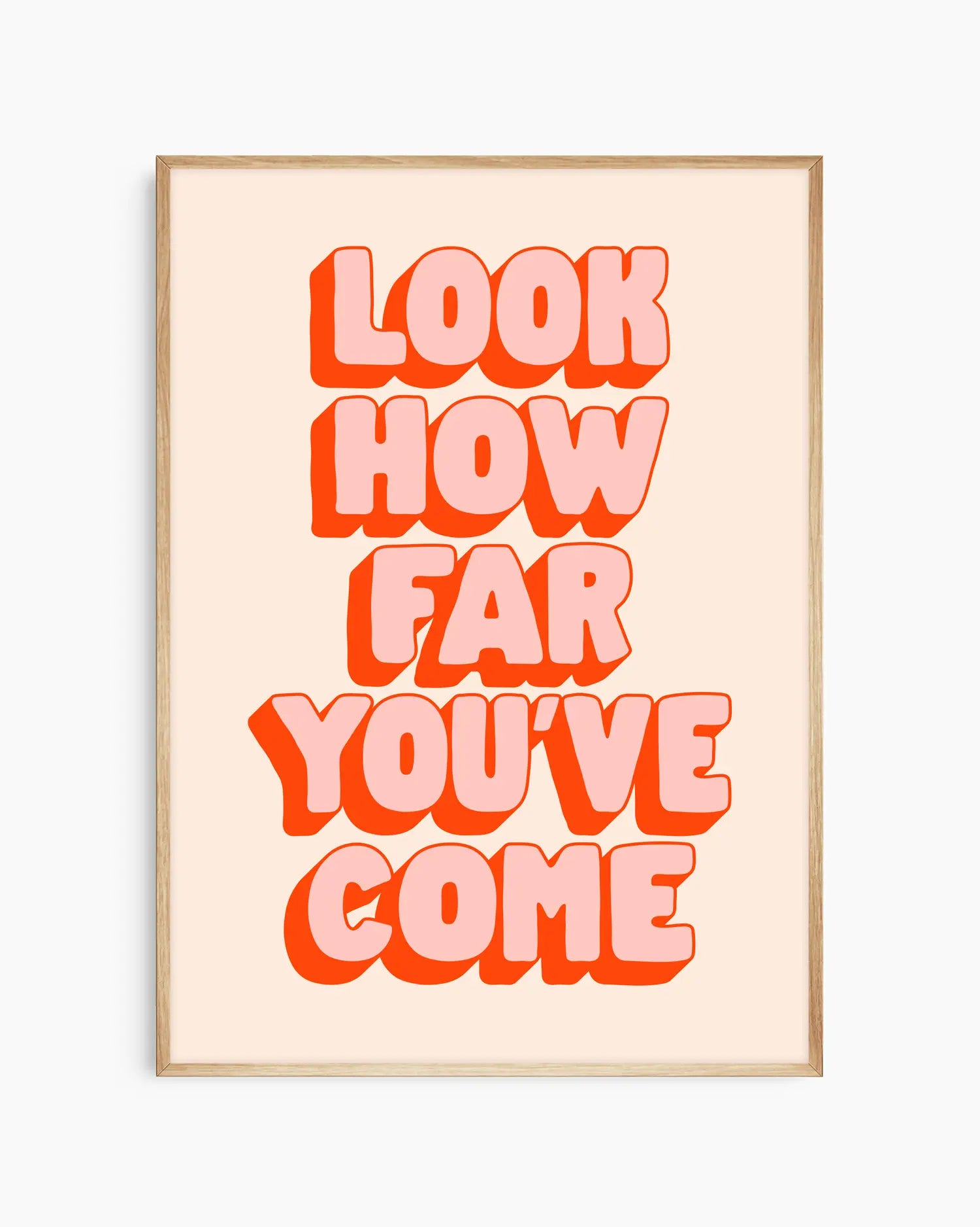 Framed poster with motivational quote 'Look how far you've come' in bold red letters on a light background