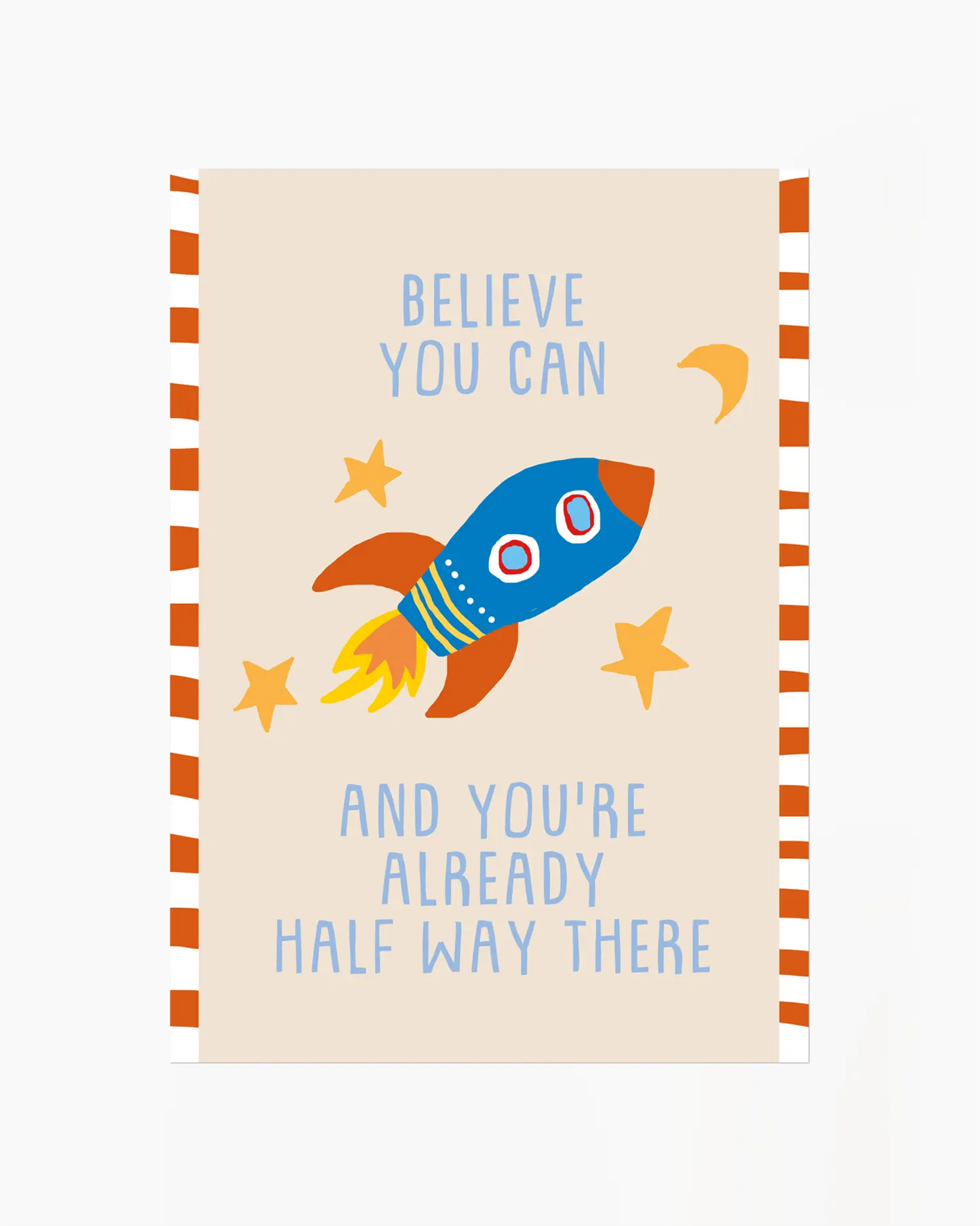 Notebook with a rocket illustration and motivational quote on a beige background
